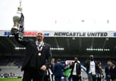 Rafa Benitez with the Championship trophy.