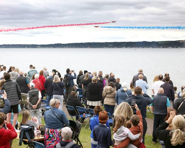 The Red Arrows dazzle spectators with their diamond nine aerobatic display across the shores of Belfast Lough