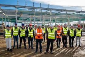 Castle site manager Aaron Robertson and John Cartwright of Hartlepool College on site with students.