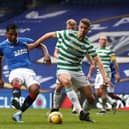 Alfredo Morelos of Rangers shoots under pressure from Kristoffer Ajer of Celtic during the Scottish Cup game between Rangers and Celtic at Ibrox Stadium on April 18, 2021 in Glasgow, Scotland.