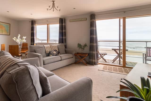 The spacious lounge area with great views out onto the beach. Image: Daniel Eland