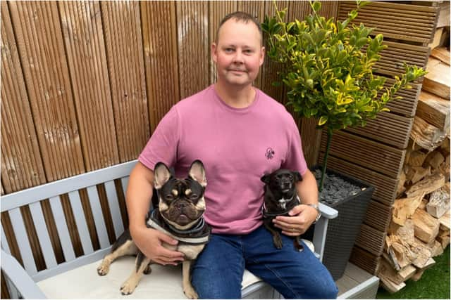 Mark Turbitt with pet dogs Woody (left) and Jessie.