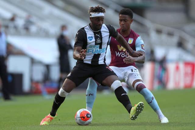 Allan Saint-Maximin of Newcastle United is challenged by Ezri Konsa Ngoyo of Aston Villa.