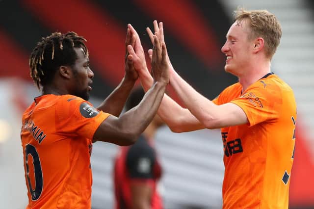 Allan Saint-Maximin, left, congratulates goalscorer Sean Longstaff.
