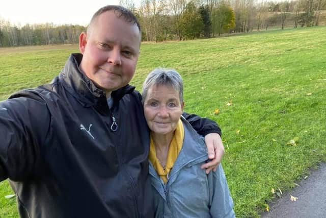Mark on the final day of his walking challenge, with his Mam