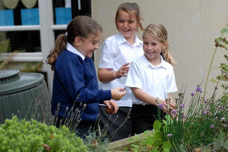 A day in the life of Whitburn Primary School in 2006 and what could be better than time spent with friends in the garden.
