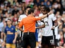 Nathaniel Chalobah of Fulham reacts after being shown a red card by match referee Darren England during the Premier League match between Fulham FC and Newcastle United at Craven Cottage on October 01, 2022 in London, England. (Photo by Tom Dulat/Getty Images)