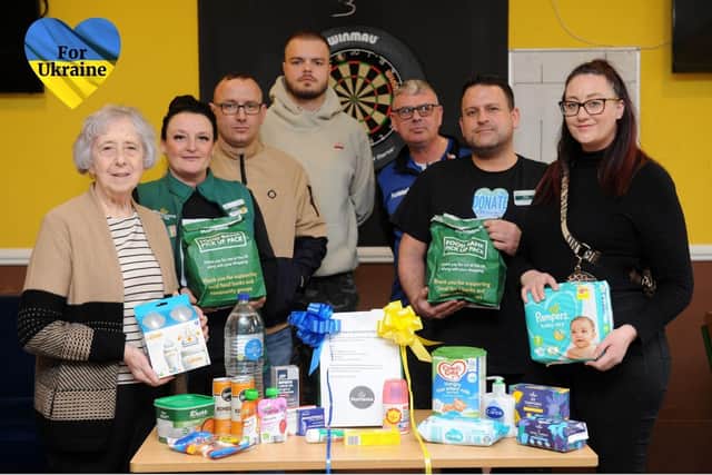 From L- R Cllr Moira Smith, Andria Willliams from Morrisons, Gavin Benos, Alex Lucas, Lee Hughes from the Red Hackle, Mark Pattinson from Morrisons and Danielle Lamoury
