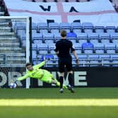 Lee Burge makes a save during Wigan Athletic's win at the DW Stadium