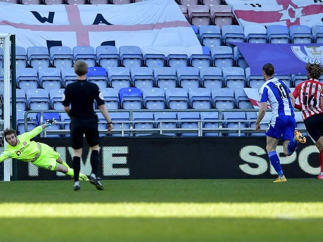 Lee Burge makes a save during Wigan Athletic's win at the DW Stadium