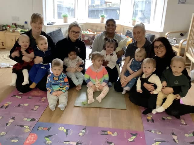 Youngsters and staff at Nurserytime with yoga teacher Vanathi Webster.