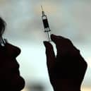 File photo of a nurse preparing to give a patient a vaccine.