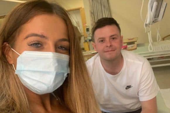 Philippa Gibbons and her boyfriend Lewis Turnbull as he was in hospital for treatment.