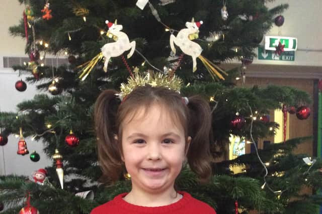 A Green Class pupil with her Christmas letter