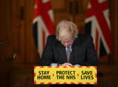 Prime Minister Boris Johnson speaks during a virtual press conference on the Covid-19 pandemic, at Downing Street on January 26, 2021. More than 100,000 people who tested positive for coronavirus have died in Britian since the pandemic took hold last year, official data showed on January 26. (Photo by Justin Tallis - WPA Pool/Getty Images)