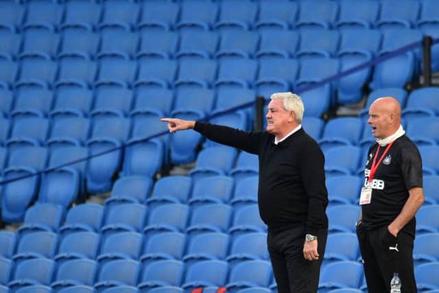 Newcastle United's English head coach Steve Bruce (L) gestures from the sidelines during the English Premier League football match between Brighton and Hove Albion and Newcastle United at the American Express Community Stadium in Brighton, southern England on July 20, 2020.
