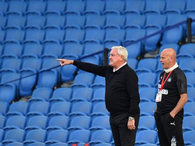 Newcastle United's English head coach Steve Bruce (L) gestures from the sidelines during the English Premier League football match between Brighton and Hove Albion and Newcastle United at the American Express Community Stadium in Brighton, southern England on July 20, 2020.