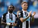 Kieran Trippier of Newcastle United applauds their fans after the final whistle of the Premier League match between Manchester City and Newcastle United at Etihad Stadium on May 08, 2022 in Manchester, England. (Photo by Stu Forster/Getty Images)