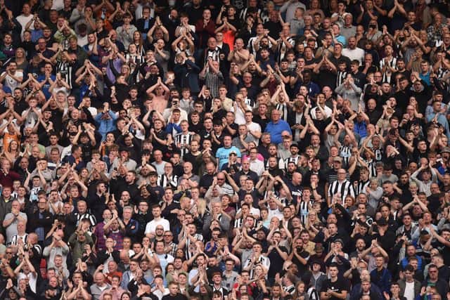 Newcastle United fans. (Photo by OLI SCARFF/AFP via Getty Images)