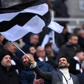 Mehrdad Ghodoussi, Co-Owner of Newcastle United, waves a black and white flag prior to  the Premier League match between Newcastle United and Leeds United at St. James Park on December 31, 2022 in Newcastle upon Tyne, England. (Photo by Stu Forster/Getty Images)