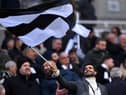 Mehrdad Ghodoussi, Co-Owner of Newcastle United, waves a black and white flag prior to  the Premier League match between Newcastle United and Leeds United at St. James Park on December 31, 2022 in Newcastle upon Tyne, England. (Photo by Stu Forster/Getty Images)
