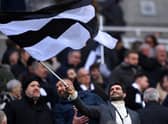 Mehrdad Ghodoussi, Co-Owner of Newcastle United, waves a black and white flag prior to  the Premier League match between Newcastle United and Leeds United at St. James Park on December 31, 2022 in Newcastle upon Tyne, England. (Photo by Stu Forster/Getty Images)