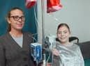 Mother Katy Jones and daughter Hannah Jones with the total parental nutrition machine used to feed Hannah.