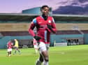 JJ Hooper, celebrating a goal against Gainsborough Trinity, with the new CEFO Ground Stand behind him. Picture: KEV WILSON.