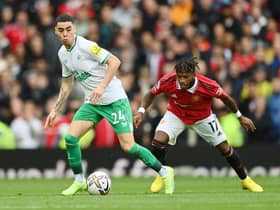 Miguel Almiron of Newcastle United is challenged by Fred of Manchester United during the Premier League match between Manchester United and Newcastle United at Old Trafford on October 16, 2022 in Manchester, England. (Photo by Dan Mullan/Getty Images)