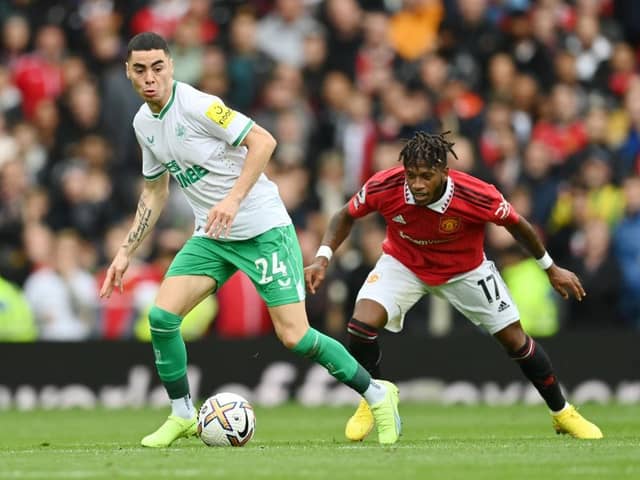 Miguel Almiron of Newcastle United is challenged by Fred of Manchester United during the Premier League match between Manchester United and Newcastle United at Old Trafford on October 16, 2022 in Manchester, England. (Photo by Dan Mullan/Getty Images)