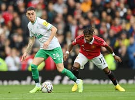 Miguel Almiron of Newcastle United is challenged by Fred of Manchester United during the Premier League match between Manchester United and Newcastle United at Old Trafford on October 16, 2022 in Manchester, England. (Photo by Dan Mullan/Getty Images)