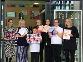 Staff and students at Epinay School with their tributes to the Queen