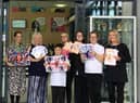 Staff and students at Epinay School with their tributes to the Queen