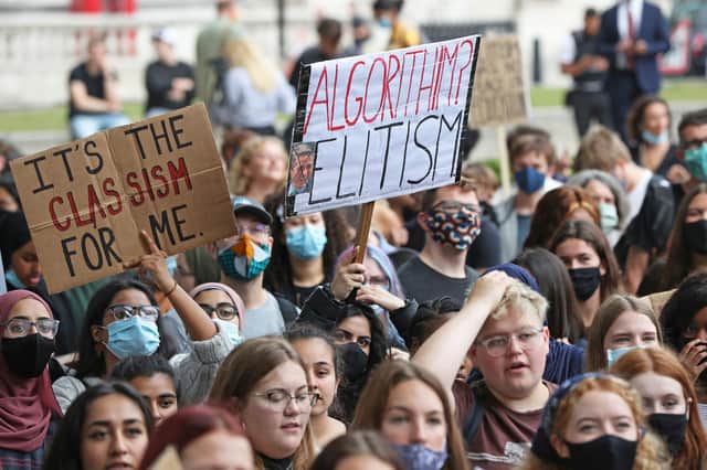 People take part in a peaceful protest in Parliament Square, London, in response to the downgrading of A-level results. Photo credit: Jonathan Brady/PA Wire
