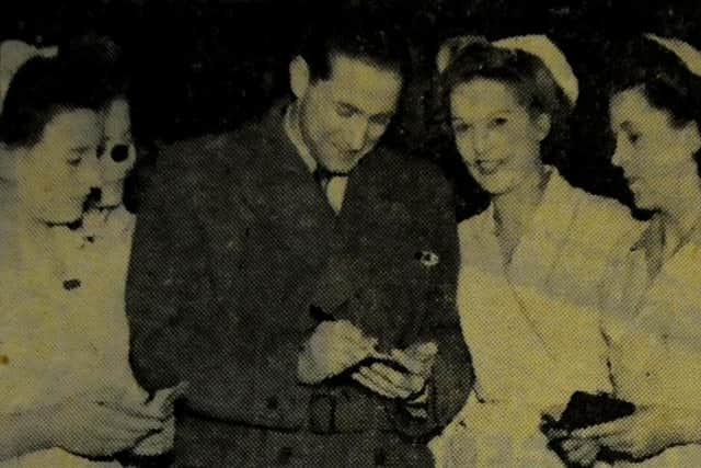 South Shields-born football legend Stan Mortensen pictured visiting the Wright's Biscuit Factory where he used to work.