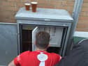 Dunston UTS FC's Phil Turnbull fixing the floodlights during their FA Trophy match against Marine AFC.