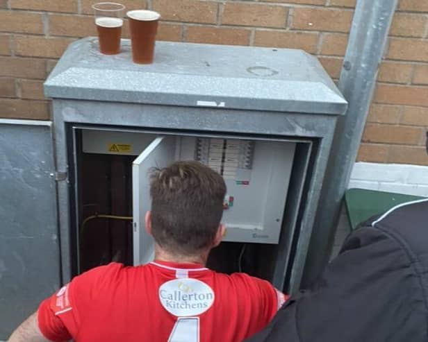 Dunston UTS FC's Phil Turnbull fixing the floodlights during their FA Trophy match against Marine AFC.