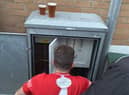 Dunston UTS FC's Phil Turnbull fixing the floodlights during their FA Trophy match against Marine AFC.