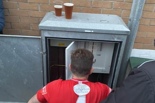 Dunston UTS FC's Phil Turnbull fixing the floodlights during their FA Trophy match against Marine AFC.
