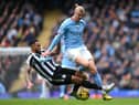 Erling Haaland of Manchester City is tackled by Jamaal Lascelles of Newcastle United during the Premier League match between Manchester City and Newcastle United at Etihad Stadium on March 04, 2023 in Manchester, England. (Photo by Laurence Griffiths/Getty Images)