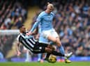 Erling Haaland of Manchester City is tackled by Jamaal Lascelles of Newcastle United during the Premier League match between Manchester City and Newcastle United at Etihad Stadium on March 04, 2023 in Manchester, England. (Photo by Laurence Griffiths/Getty Images)