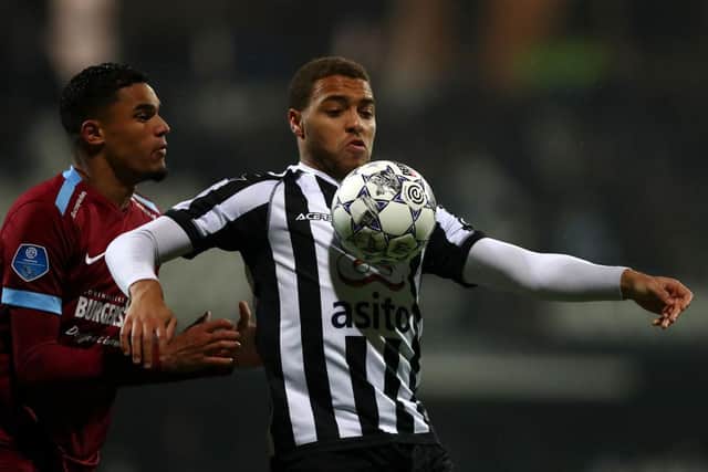 Cyriel Dessers of Heracles Almelo battles for the ball with Danilho Doekhi of Vitesse Arnhem during the Dutch Toto KNVB Cup match between Heracles Almelo and Vitesse at Polman Stadion on January 22, 2020 in Almelo, Netherlands.