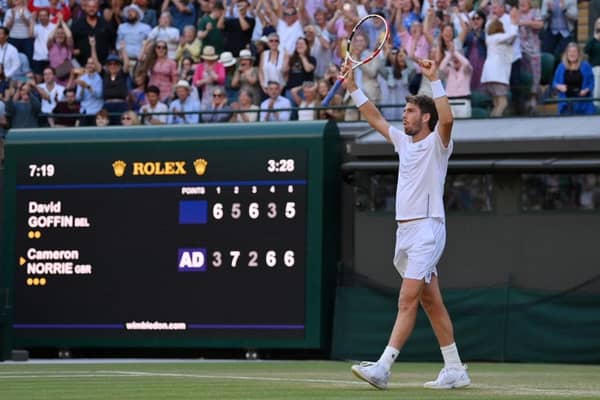 Cameron Norrie of Great Britain celebrates after winning match point against David Goffin of Belgium during their Men's Singles Quarter Final match on day nine of The Championships Wimbledon 2022 at All England Lawn Tennis and Croquet Club on July 05, 2022 in London, England. (Photo by Justin Setterfield/Getty Images)