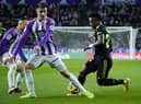 Real Valladolid's Spanish defender Ivan Fresneda (C) vies with Real Madrid's Brazilian forward Vinicius Junior during the Spanish League football match between Real Valladolid FC and Real Madrid CF at the Jose Zorilla stadium in Valladolid on December 30, 2022. (Photo by CESAR MANSO / AFP) (Photo by CESAR MANSO/AFP via Getty Images)