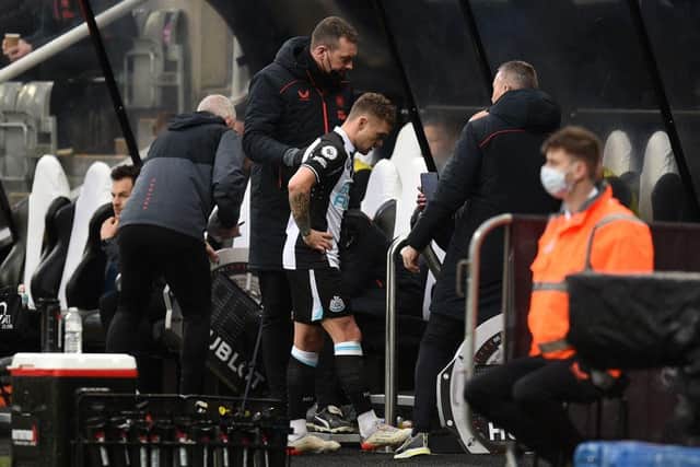 Kieran Trippier leaves the pitch injured.