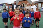 East Boldon Infants' School pupils and staff celebrating their good Ofsted judgement.