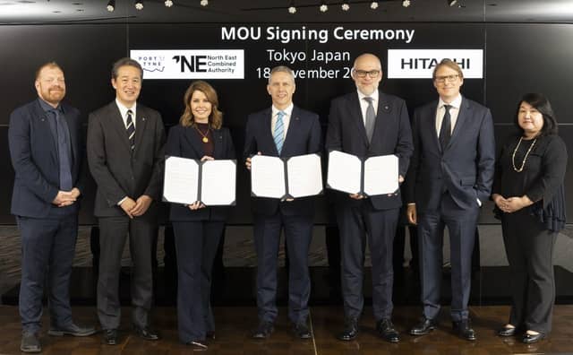 Mayor Kim McGuinness with Port of Tyne's Matt Beeton and Hitachi's Andrew Barr show their agreements, signed in Japan, to benefit the North East.
