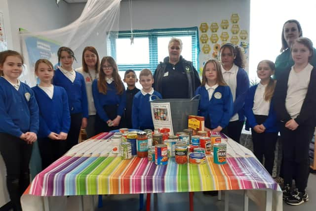 Toner Avenue Primary School pupils with some of the donated items, alongside Acting Headteacher, Claire Hutchinson, Year One teacher Tracey Finnigan, and Hebburn Helps Co-founder  Jo Durkin.