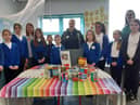 Toner Avenue Primary School pupils with some of the donated items, alongside Acting Headteacher, Claire Hutchinson, Year One teacher Tracey Finnigan, and Hebburn Helps Co-founder  Jo Durkin.