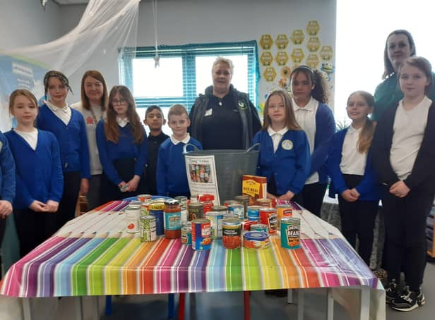 Toner Avenue Primary School pupils with some of the donated items, alongside Acting Headteacher, Claire Hutchinson, Year One teacher Tracey Finnigan, and Hebburn Helps Co-founder  Jo Durkin.